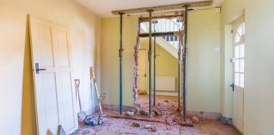 Removing,A,Wall,During,A,Home,Renovation,,Uk,Building,Work